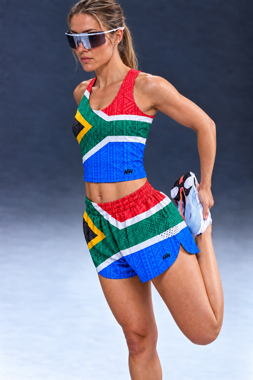 Model wearing Martin West Designs SA Flag Lasercut Runshort with matching crop top